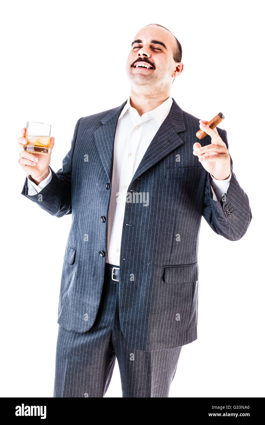 portrait of a classy businessman toasting with a glass of whiskey and smoking a cigar isolated over a white background Stock Photo