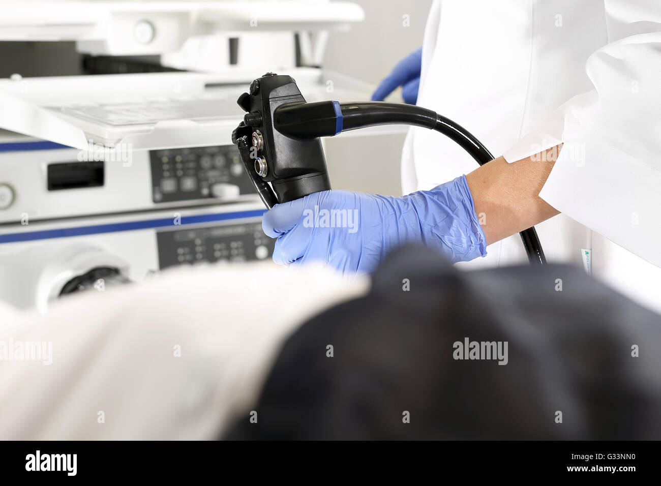 Doctor gastroenterologist with probe to perform gastroscopy and