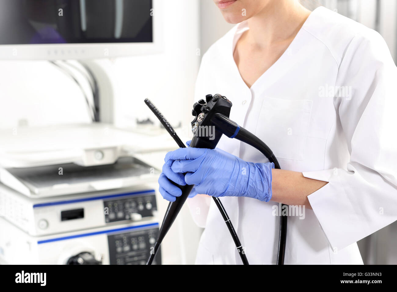 Doctor gastroenterologist with probe to perform gastroscopy and