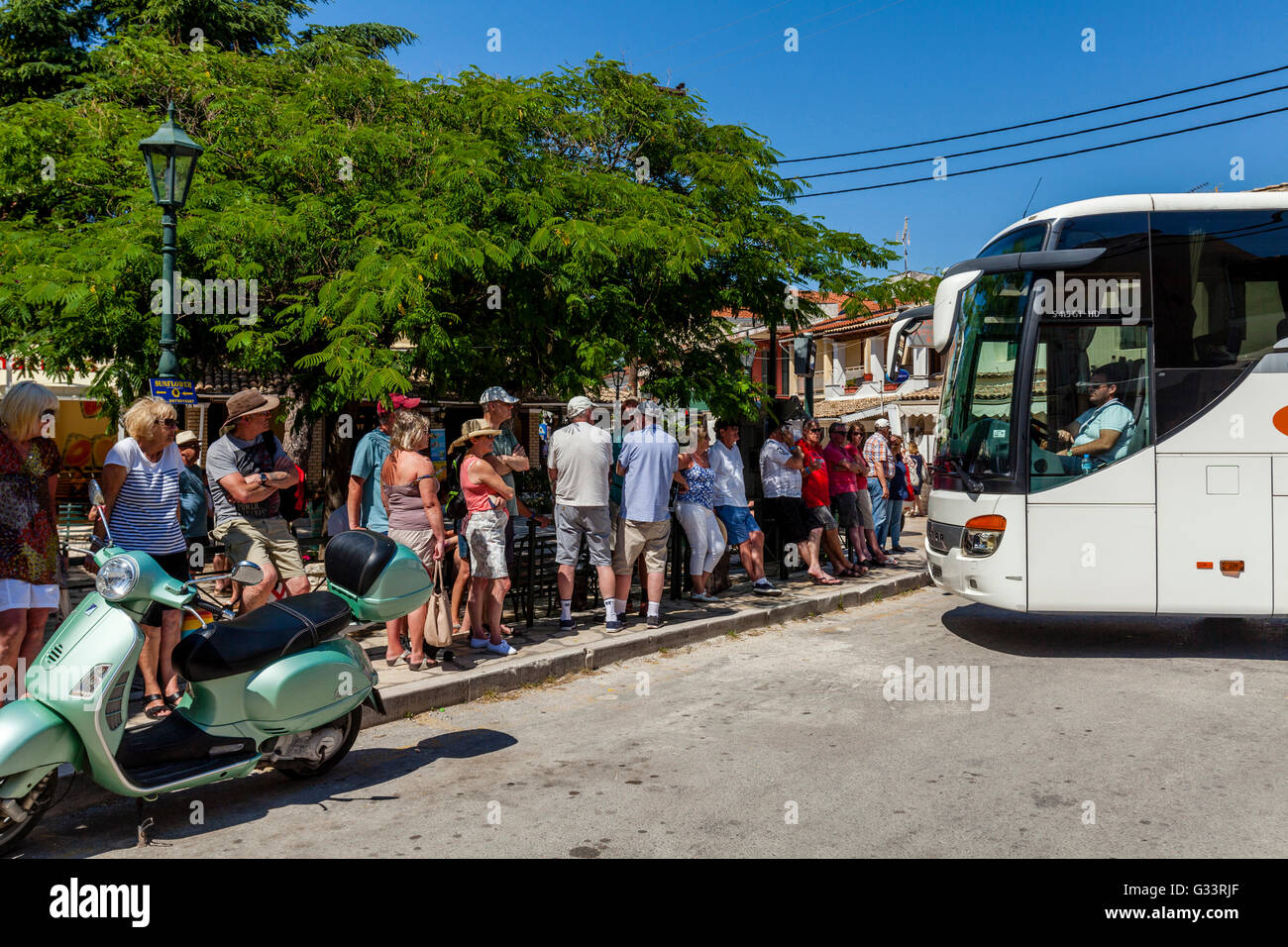 Tourists Waiting For A Bus, Kassiopi, Corfu, Greece Stock Photo Alamy