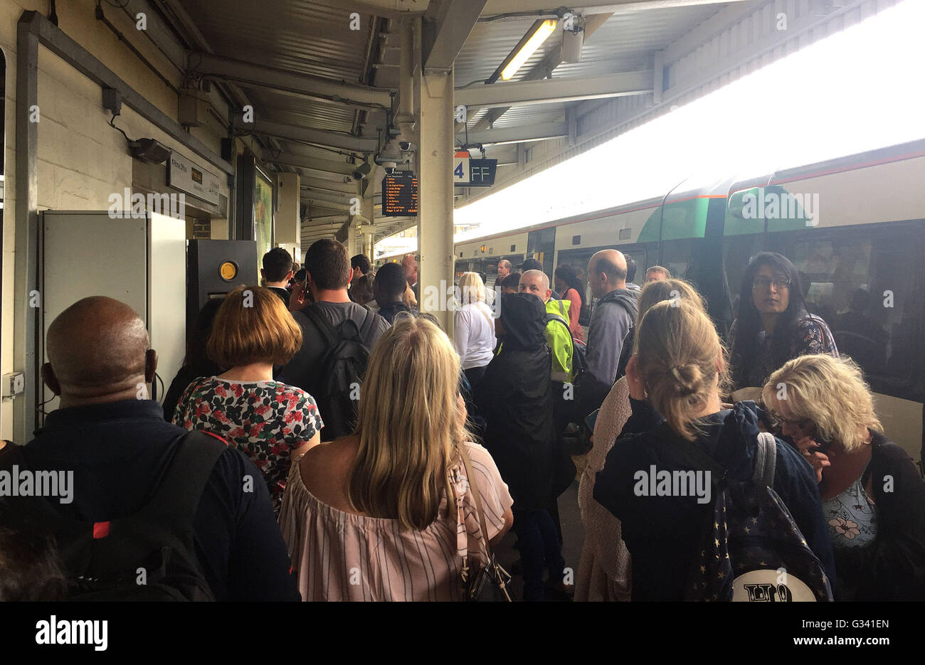 Stranded passengers at at West Croydon train station after trains were cancelled because of flooding in Sutton, as flash flooding has seen people rescued from submerged cars and hundreds of calls made to emergency services as torrential rain and thunderstorms batter the UK. Stock Photo