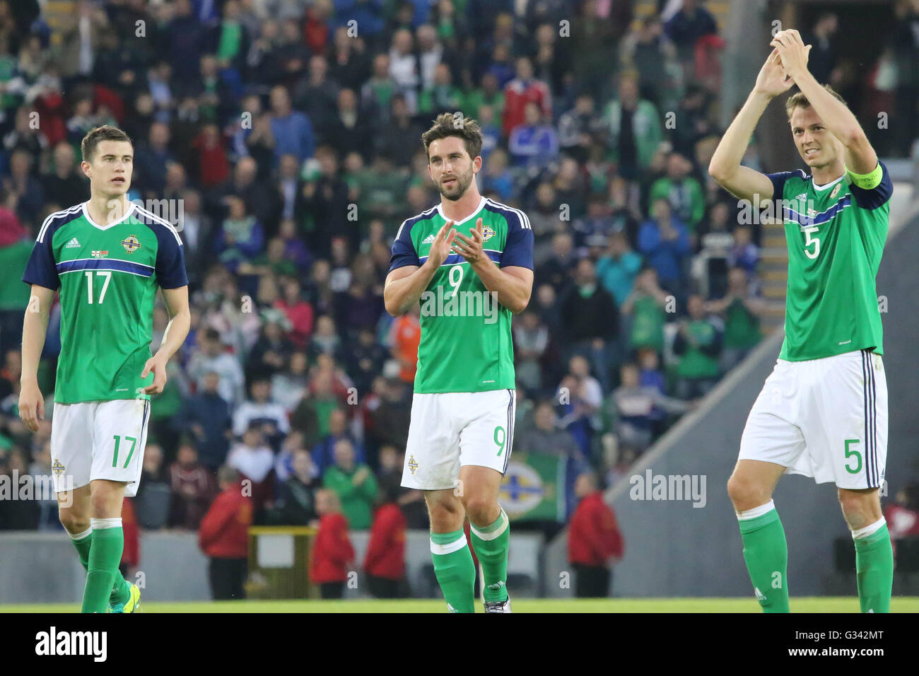 27th May 2016 - Vauxhall International Challenge (Friendly). Northern Ireland 3 Belarus 0. Northern Ireland players Paddy McNair (17), Will Grigg (9) and Jonny Evans (5) celebrate the win before the Euros. Stock Photo