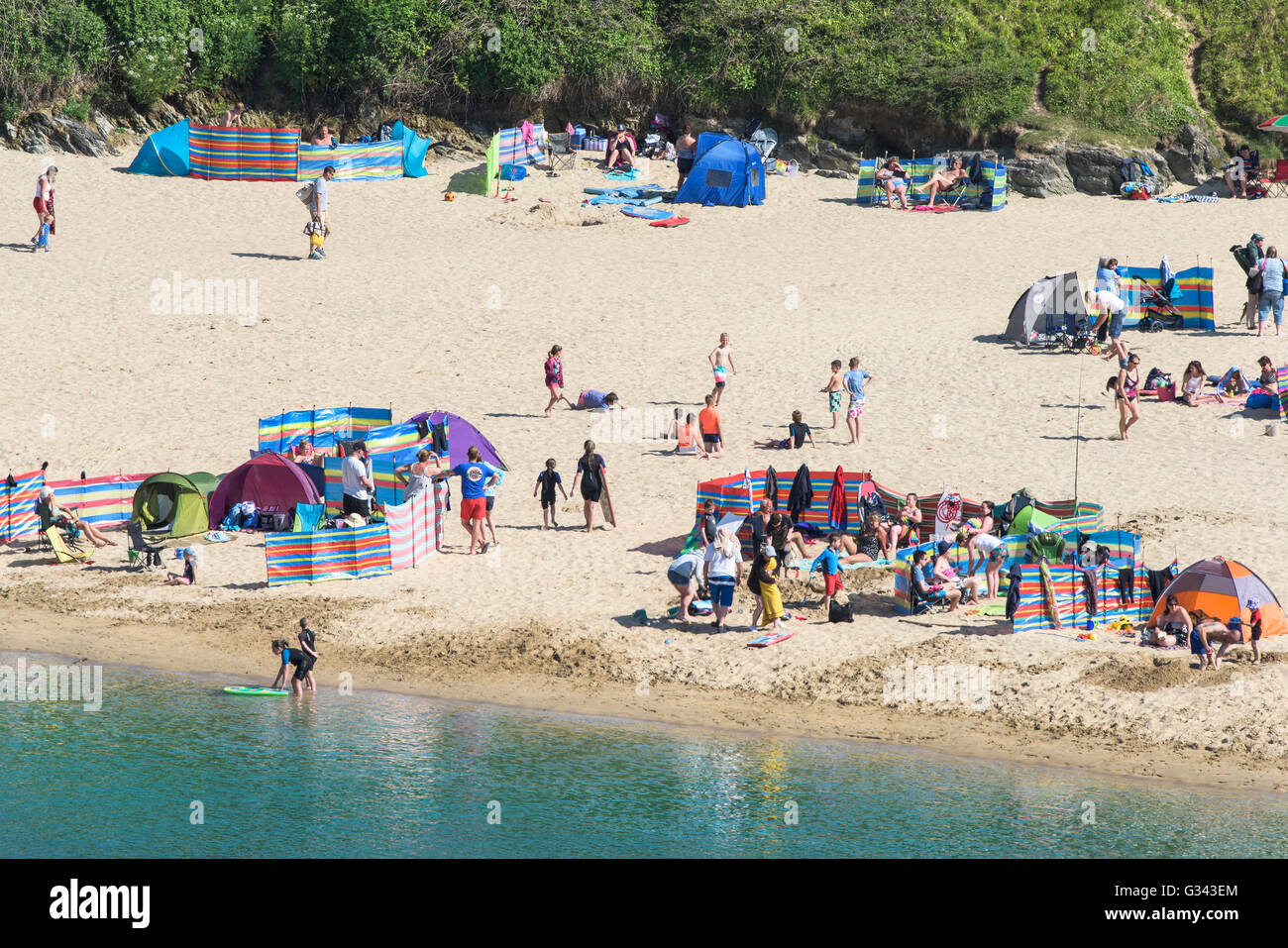 Holidaymakers enjoy the sunny weather on Crantock Beach in Newquay, Cornwall. Stock Photo