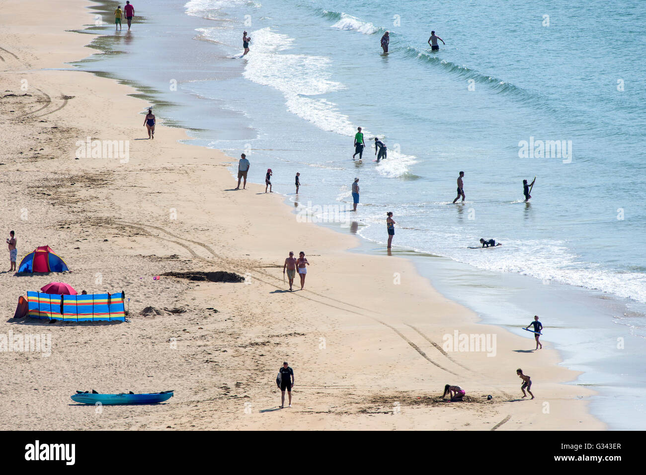 Holidaymakers enjoy the sunny weather on Crantock Beach in Newquay, Cornwall. Stock Photo