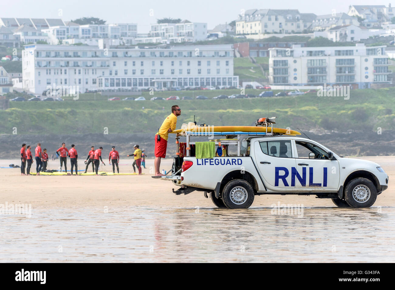 A RNLI Lifeguard on duty at Fistral Beach in Newquay, Cornwall. Stock Photo