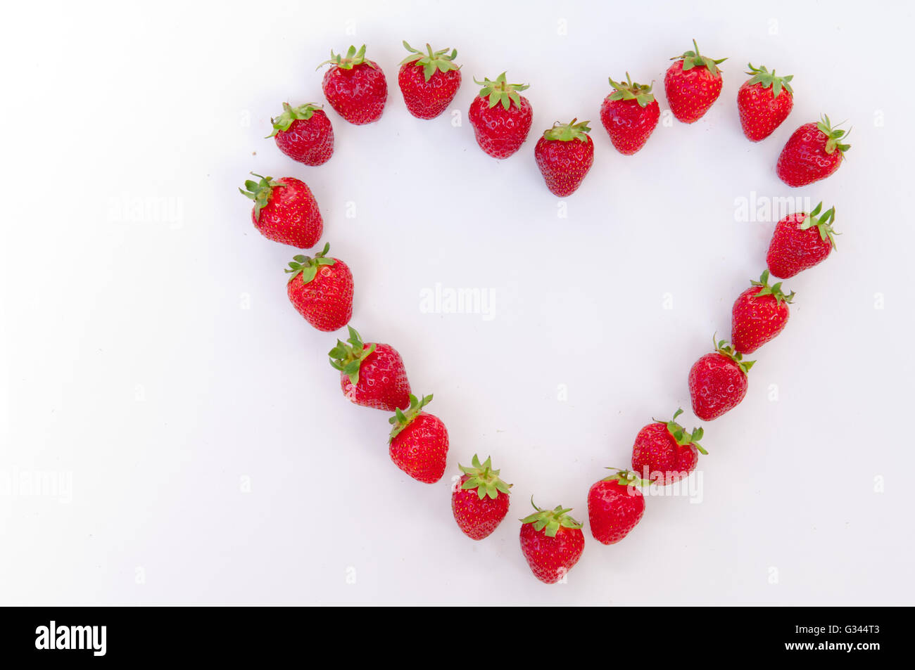 Heart shaped strawberries on white background, strawberry heart, isolated  Stock Photo - Alamy