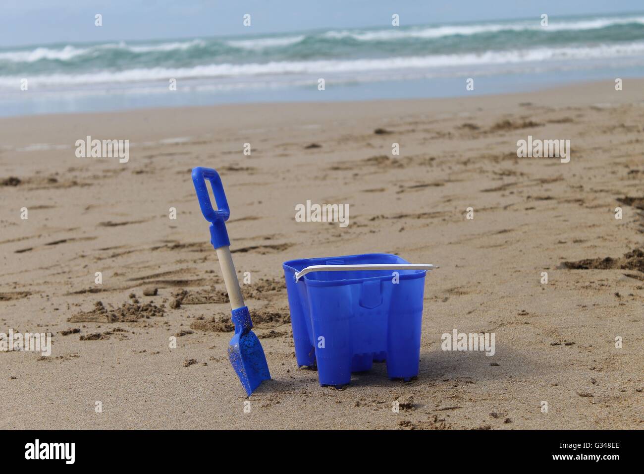 Bucket and spade on a beach in Cornwall, summer holiday, British summer