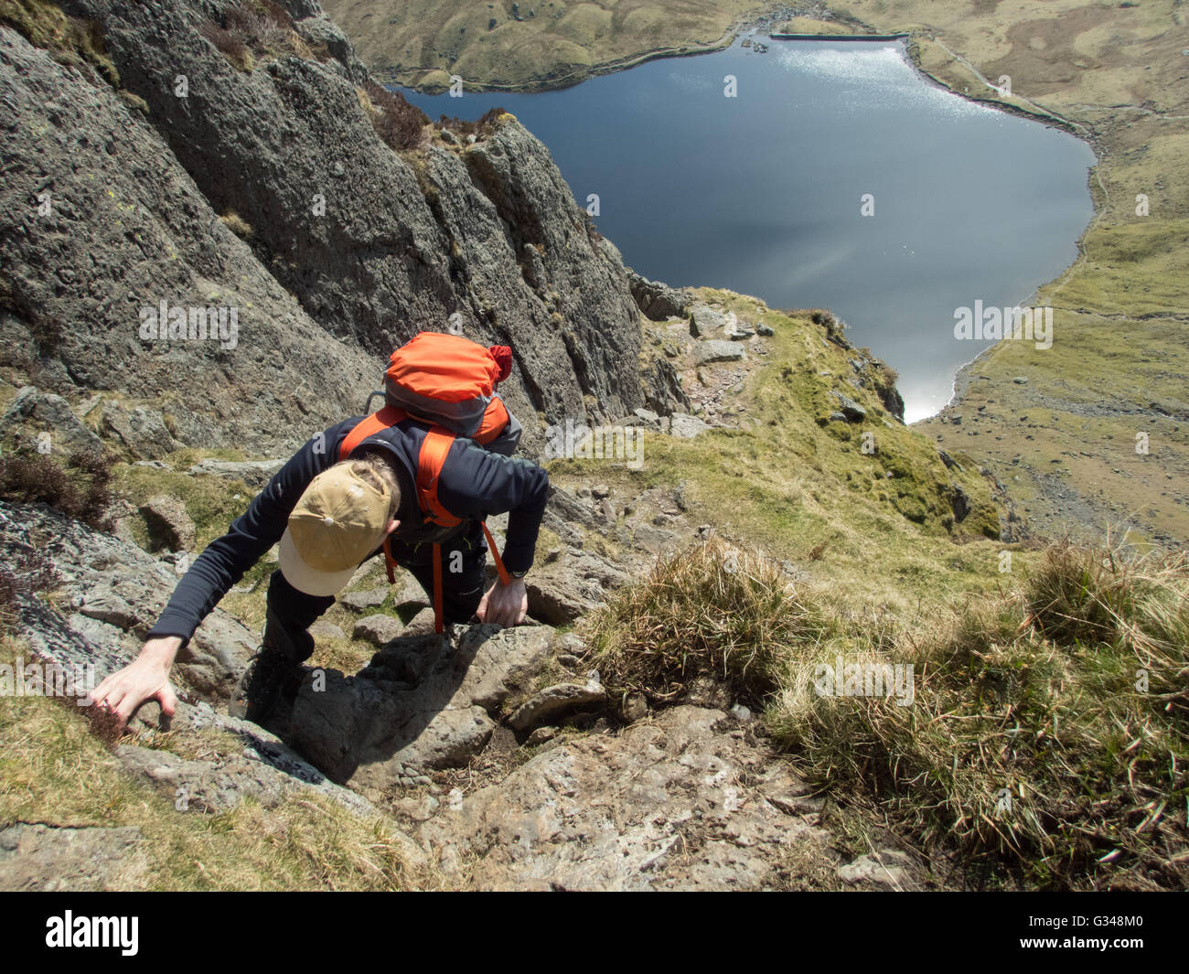 Scrambling up the classic route Jack's Rake on Pavey Ark, Langdale Pikes, Lake District National Park, Cumbria, UNESCO World Heritage Site Stock Photo