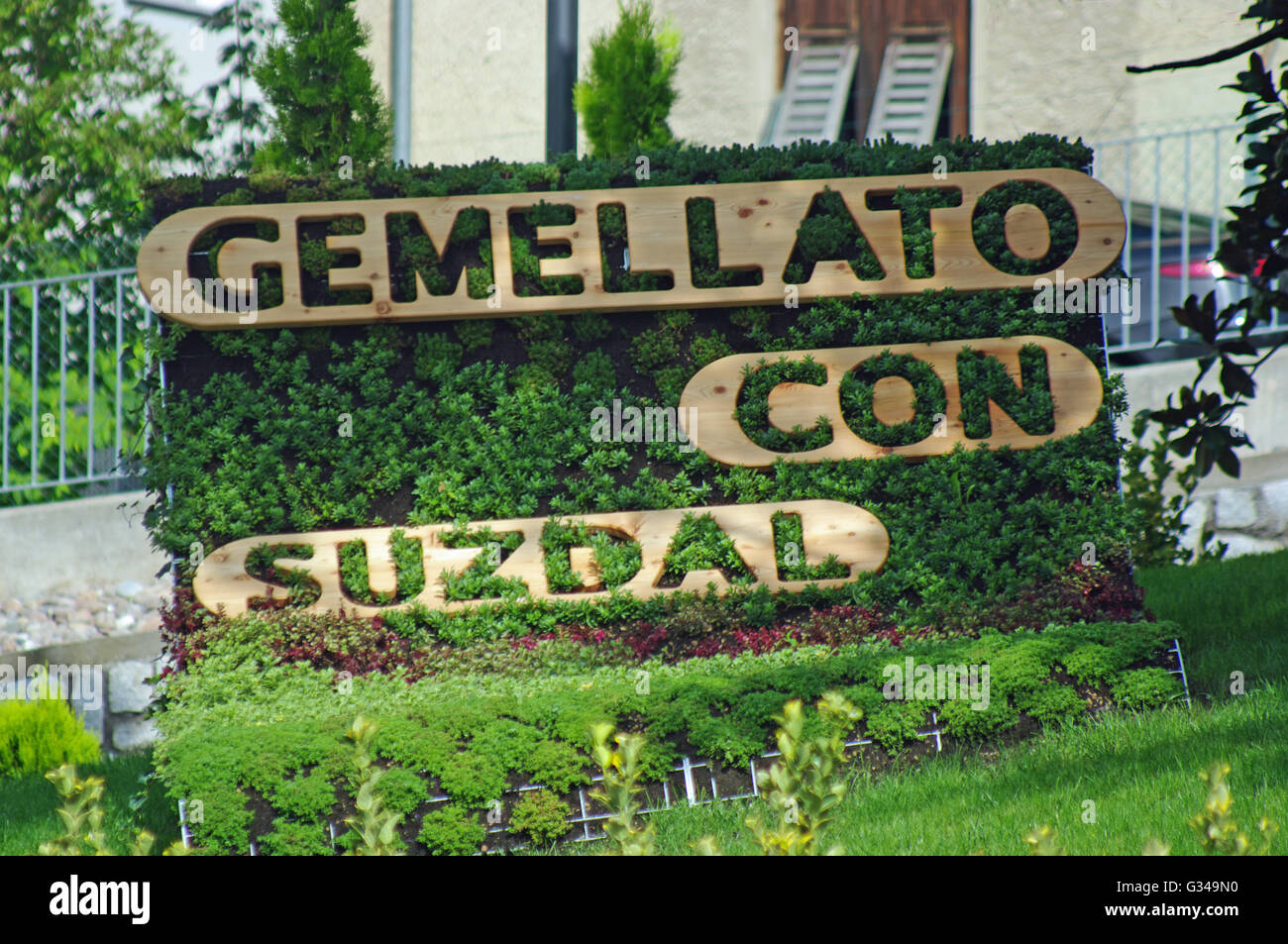 Gemellato Con Suzdal Sign, Cles Village, Dolomites Hills, Italy Stock Photo Alamy