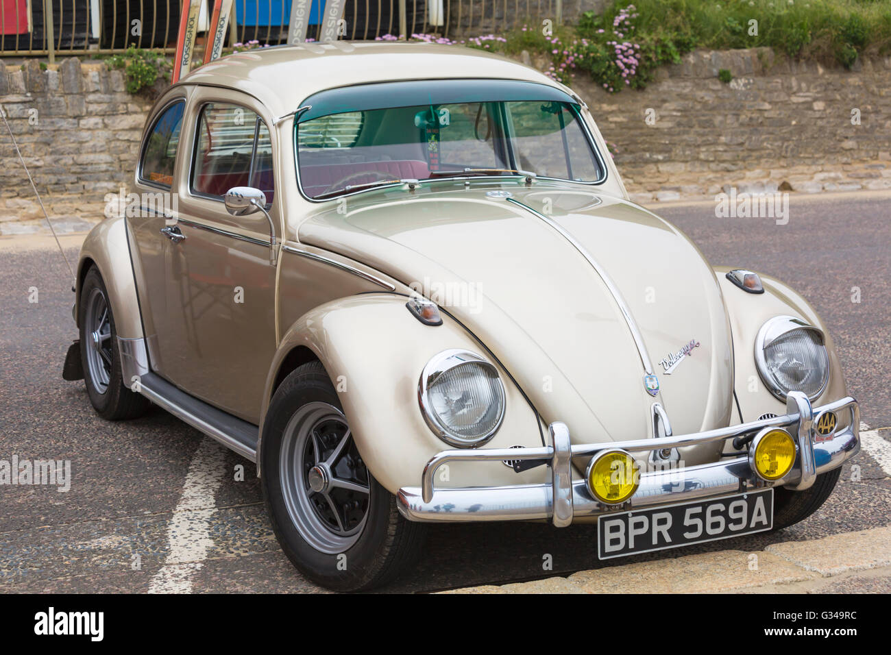 Gold coloured Volkswagen beetle at Bournemouth Wheels Festival at Bournemouth, Dorset UK in June Stock Photo