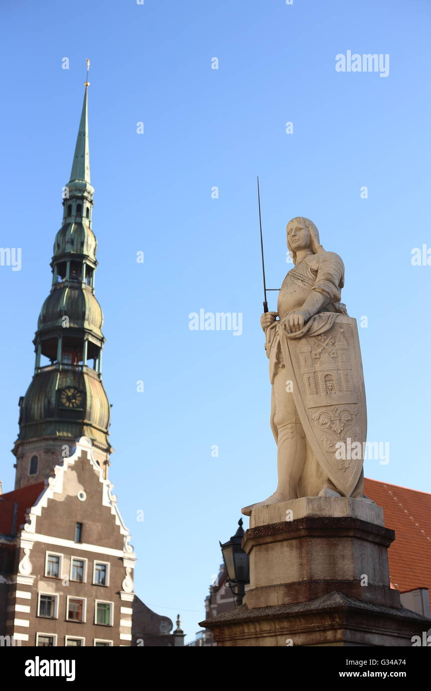 A picture of statue of Roland, behind it Saint Peter's cathedral, Riga. Stock Photo