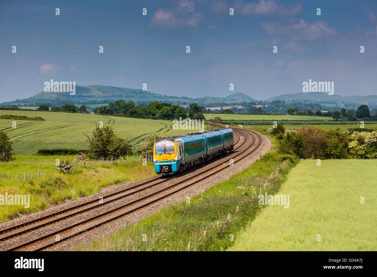Arriva Trains Wales service on the Marches Line (Cardiff to Manchester) between Craven Arms And Church Stretton, Shropshire Stock Photo