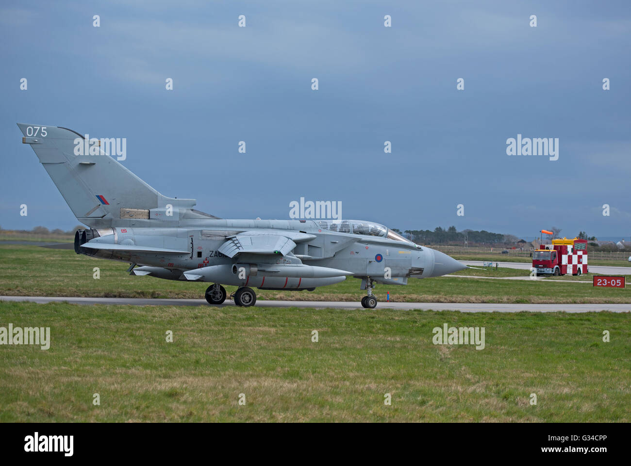 An RAF GR4 Tornado on the perimeter taxiway at the Lossiemouth home base in Scotland.  SCO 10,493. Stock Photo