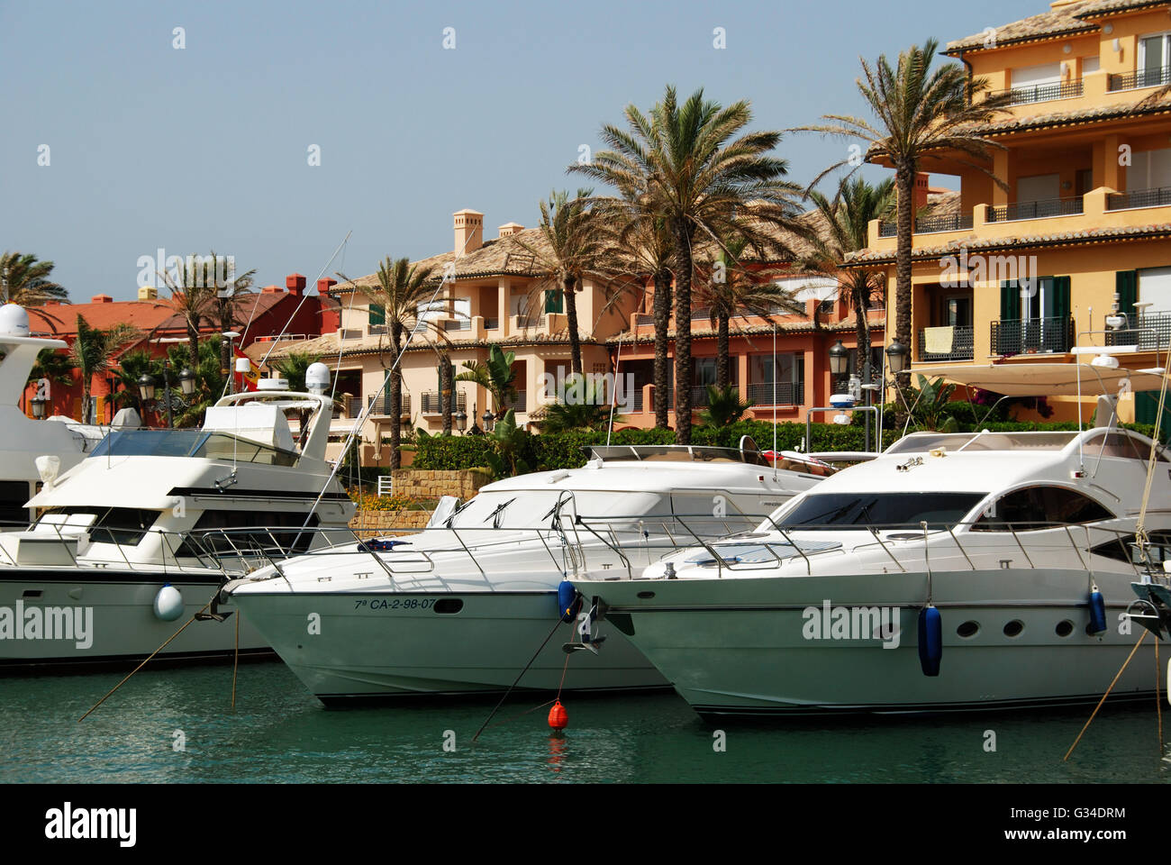 Yachts and boats in the marina with buildings to the rear, Puerto