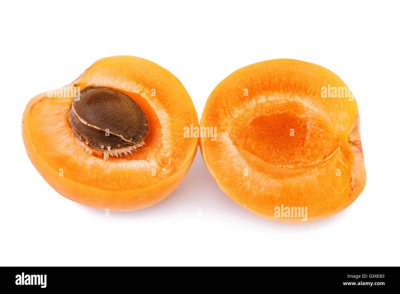 Apricot with fruit kernel on white background. Closeup. Stock Photo