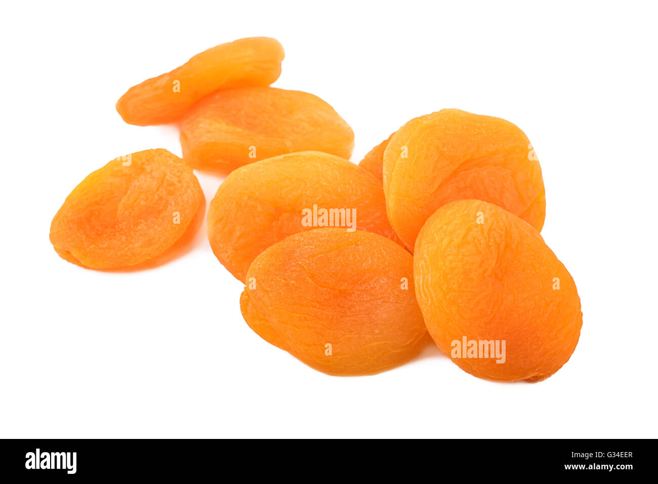Dried apricots heap on white background.Closeup. Stock Photo