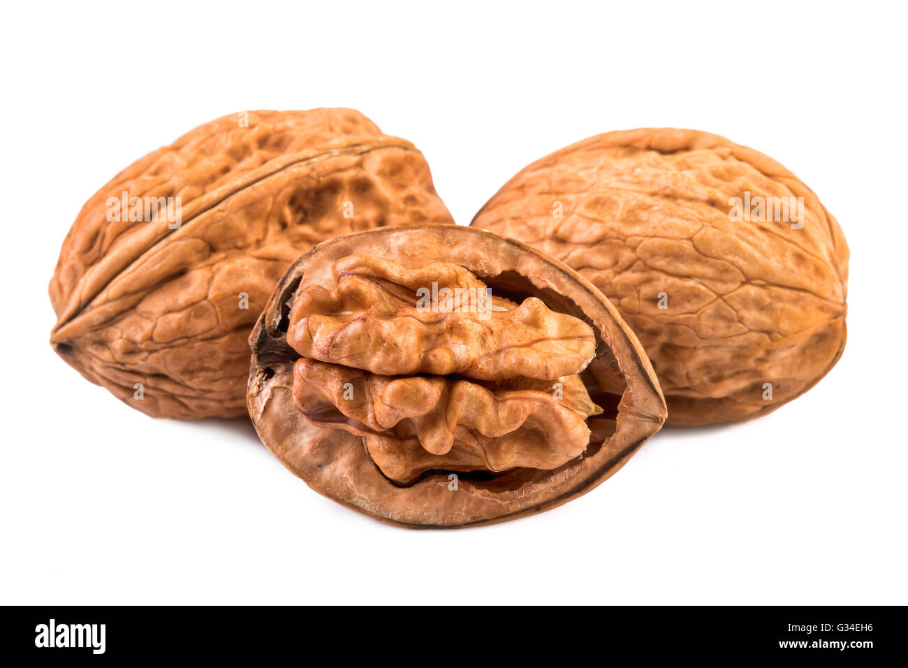 Walnuts whole and half in closeup. Stock Photo