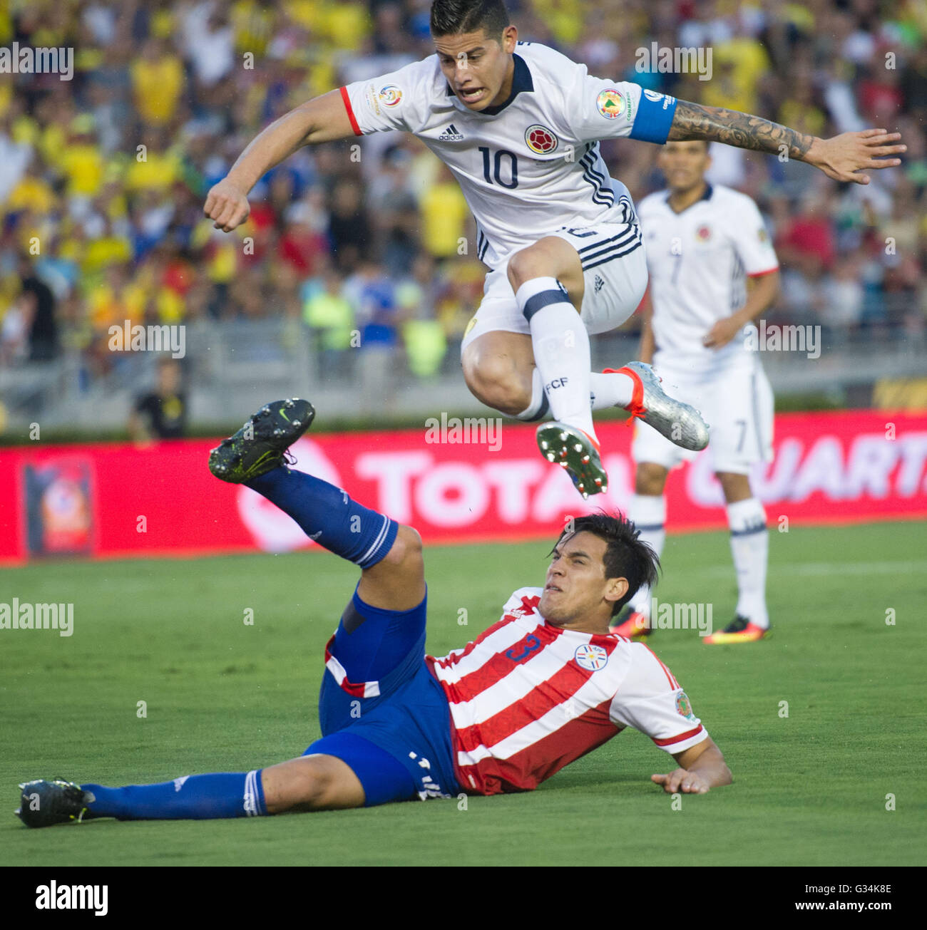 Pasadena, USA. 7th June, 2016. Colombia's James Rodriguez (Top) jumps over Paraguay's Gustavo Raul Gomez during the Copa America Centenario Group A match at Rose Bowl Stadium in Pasadena, California, the United States, June 7, 2016. © Yang Lei/Xinhua/Alamy Live News Stock Photo