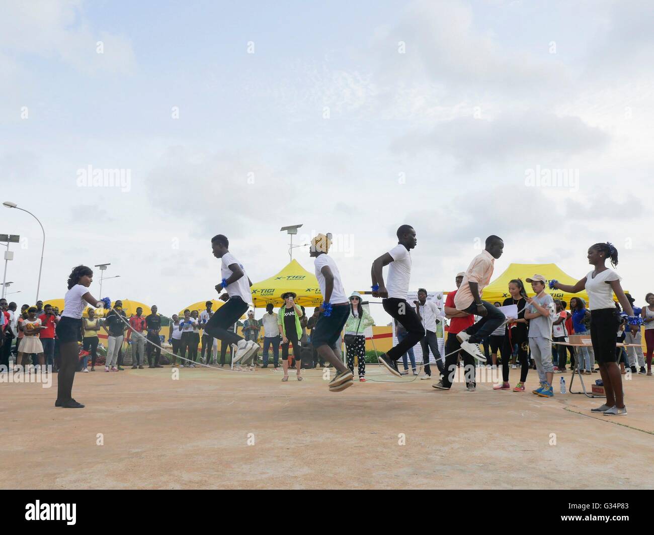 Cotonou, Benin. 6th June, 2016. Students skip rope during a sports game