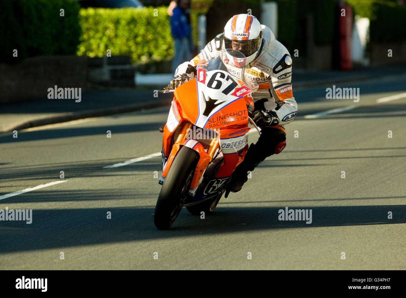 Isle of Man TT race 2016 BMW Superstock motorbike number 67 ridden by David Hewson, sponsered by Obsession Engineering, on Brae Hill at 180 mph. Monday 6th June 2016. Stock Photo