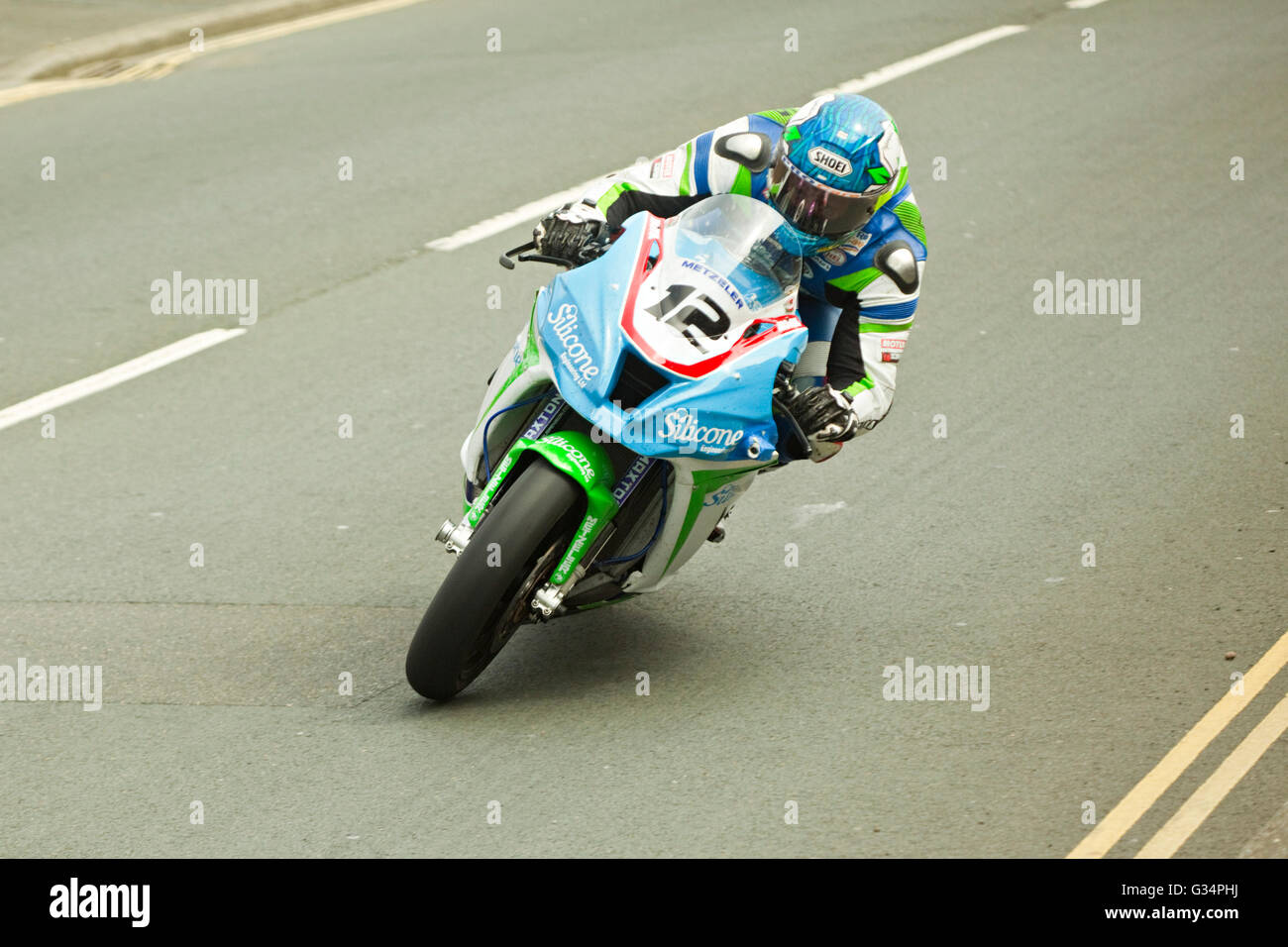 Isle of Man TT race 2016 Kawasaki Superbike motorbike number 12 ridden by Dean Harrison, sponsored by Silicone Engineering, on Brae Hill at 180 mph. Saturday 4th June 2016. Stock Photo