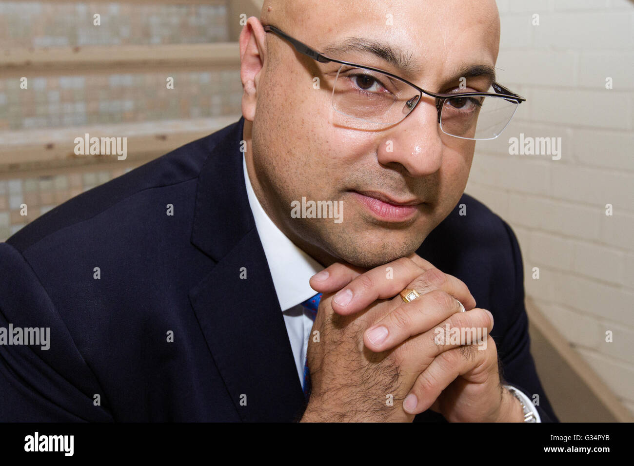 Canadian television journalist, Ali Velshi poses for a picture before receiving an honorary