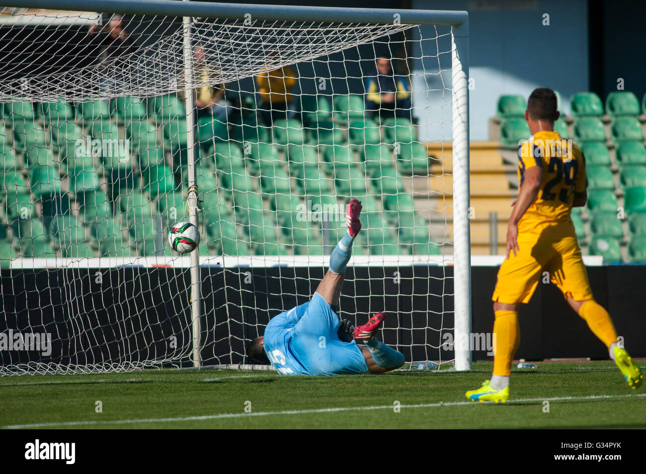 The goalkeeper of Aris FC Limassol Entin Nuredinofski on the air trying to catch the ball Stock Photo