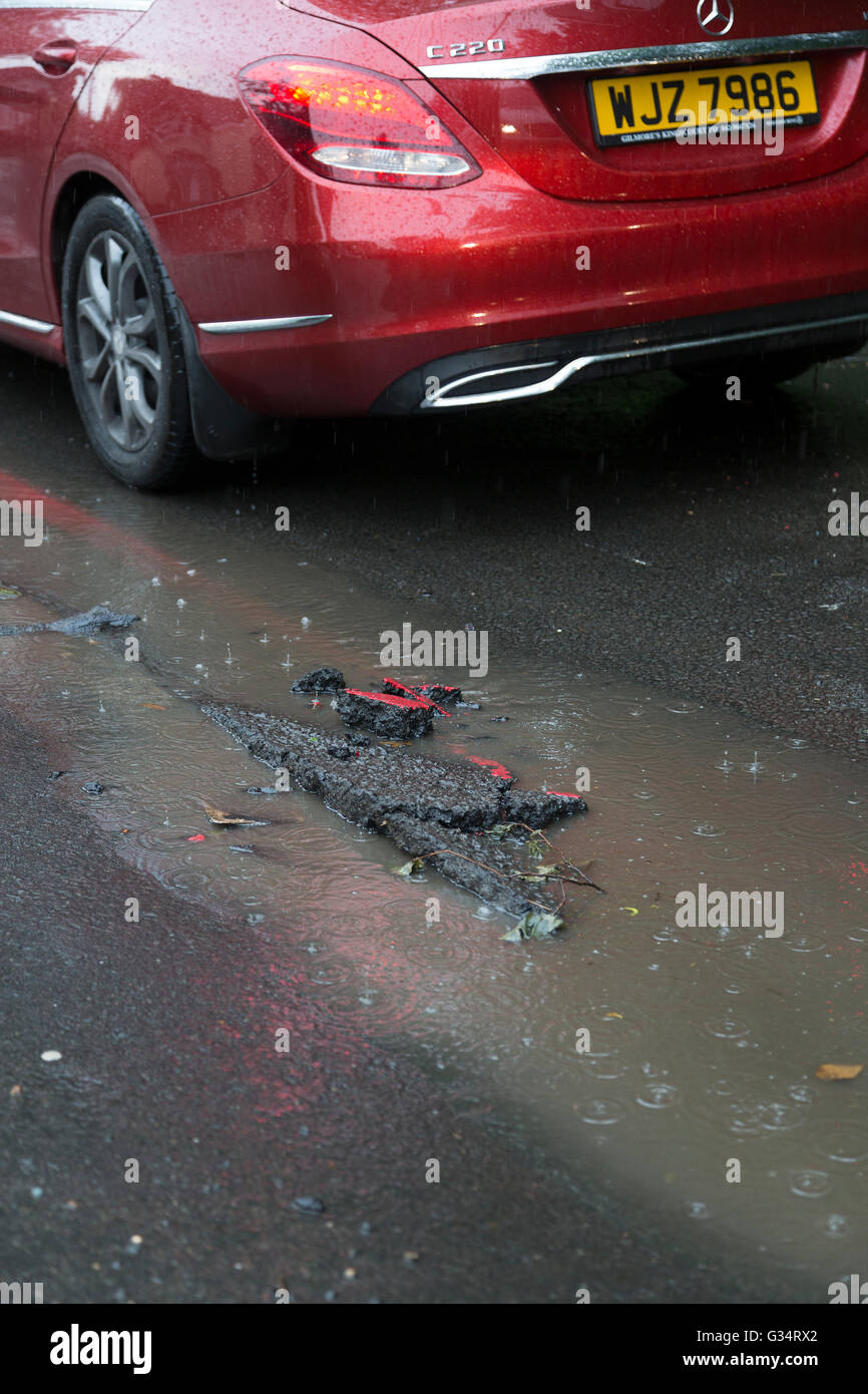 Purley, London, UK. 8th June, 2016. A section of damaged road following torrential rain. Credit:  Dave Stevenson/Alamy Live News Stock Photo