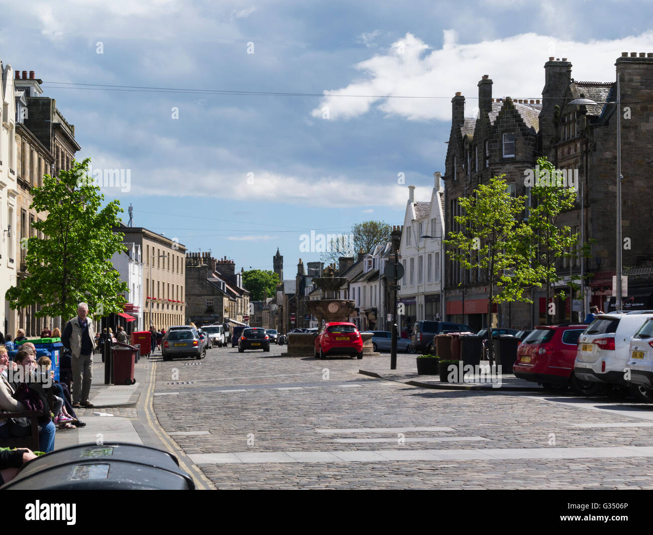 View along Market Street historic Royal Burgh St Andrews Fife Scotland cobbled street flanked by shops cafes restaurants pubs in historic buildings Stock Photo