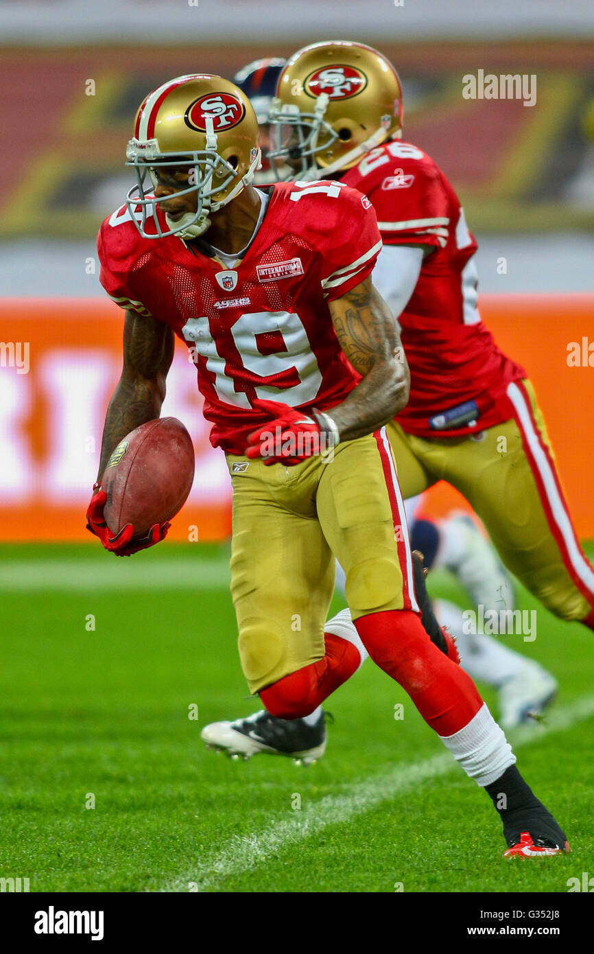 WR Ted Ginn, #19 49ers, runs with the ball during the NFL International game between the San Francisco 49ers and the Denver Stock Photo