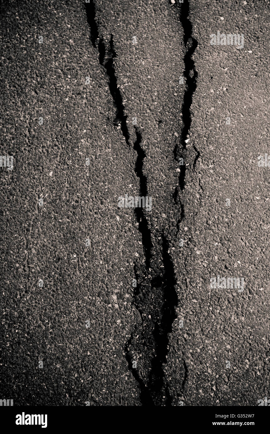 Broken asphalt Stock Photo - Alamy
