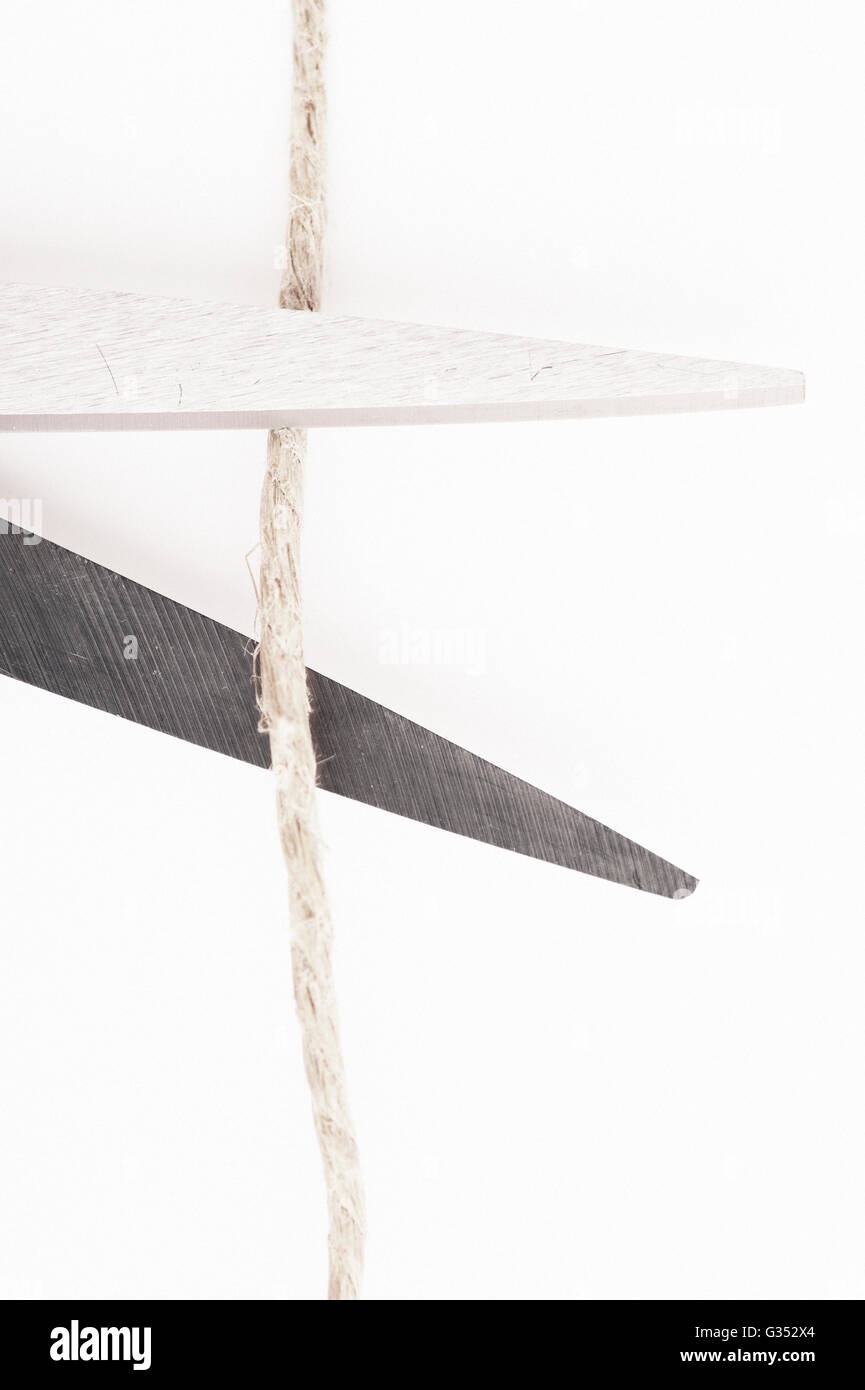 Scissors cutting string Stock Photo Alamy