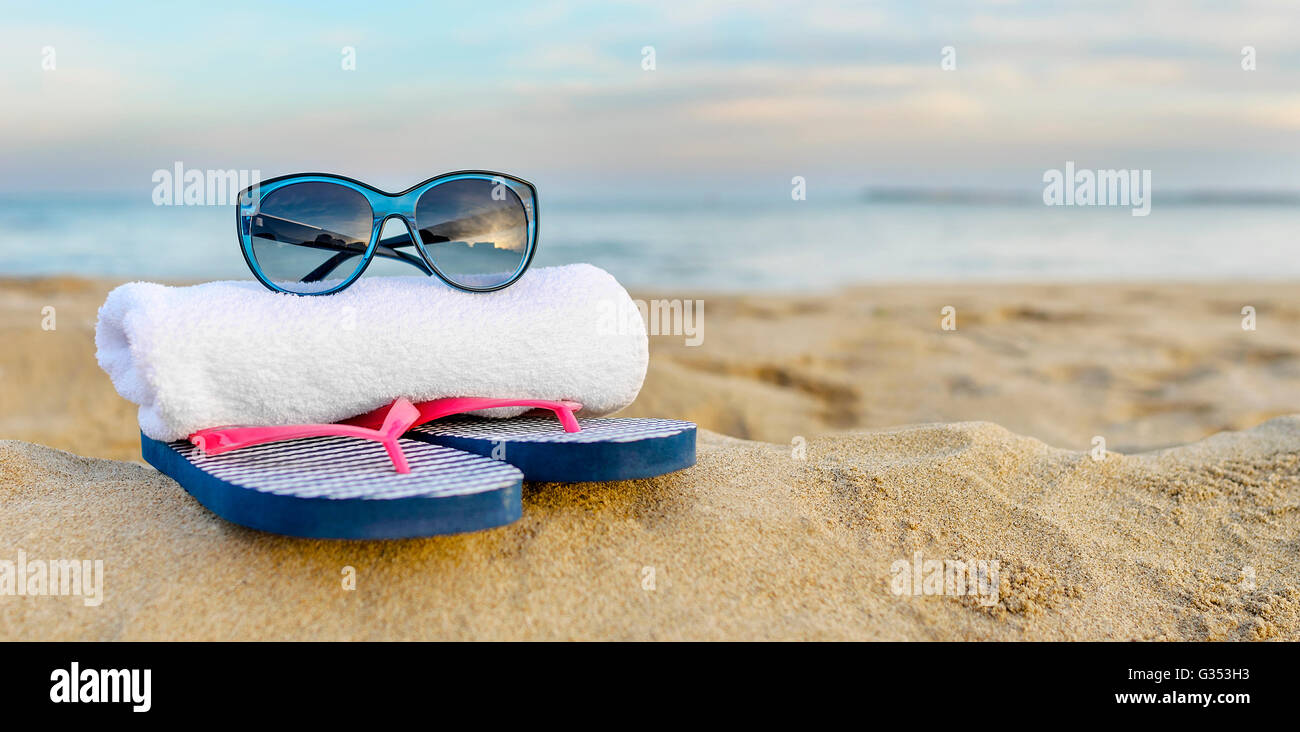 Marine still life. Flip flops, sunglasses and starfish on sea and sky ...