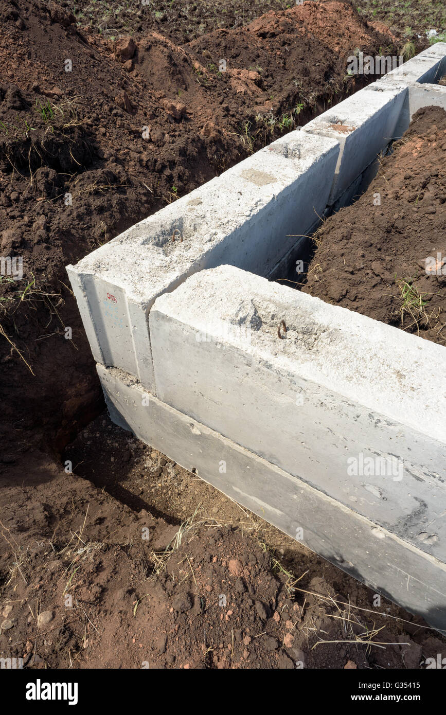 Grey construction concrete building blocks used for the foundations of