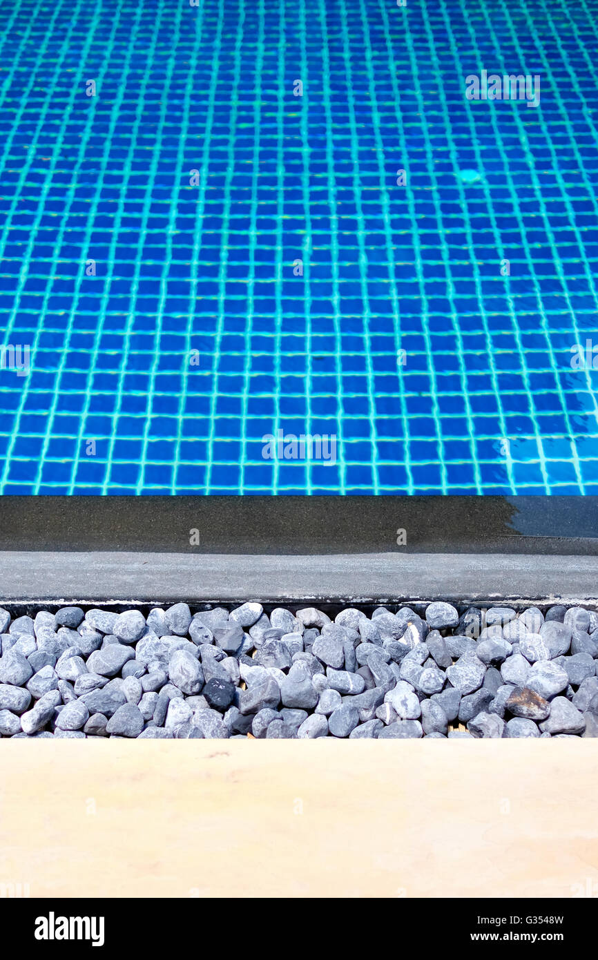 Background image of swimming pool with grid pattern ceramic tiled floor, vertical orientation suitable for phone Stock Photo