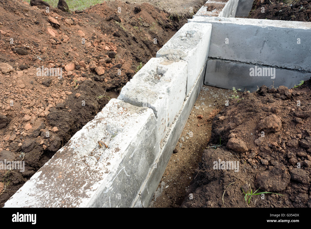 Grey construction concrete building blocks used for the foundations of