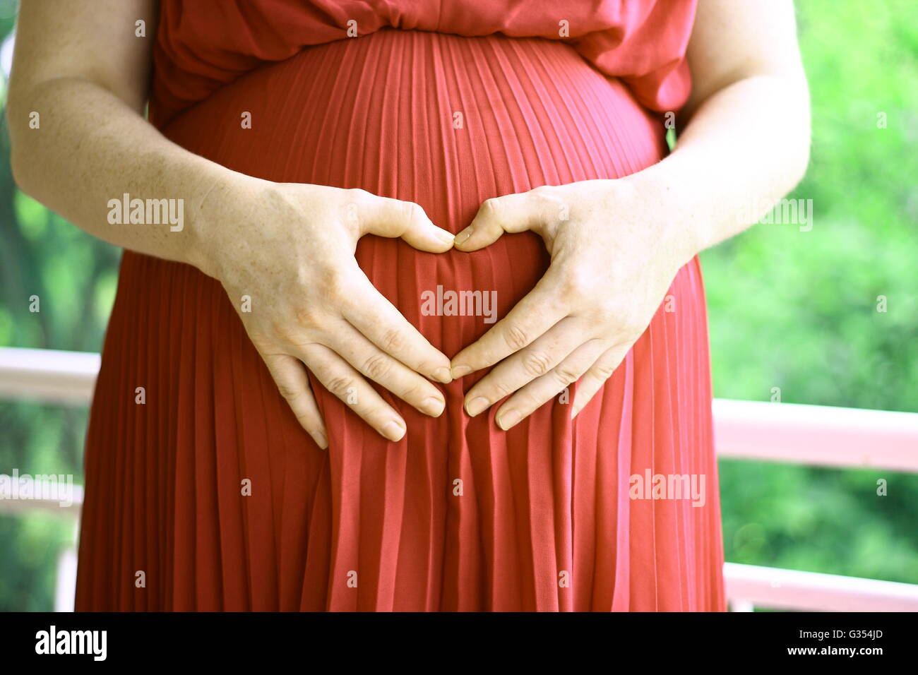 Pregnant woman expecting child Stock Photo - Alamy