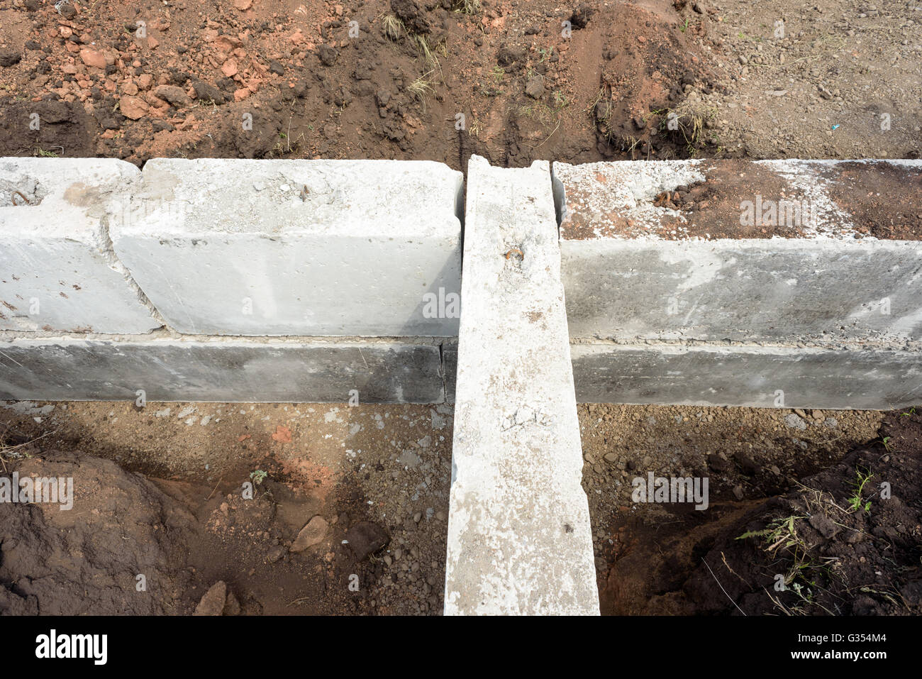 Grey construction concrete building blocks used for the foundations of