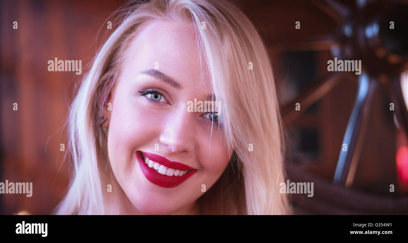 Beautiful blonde woman smiling to the camera Stock Photo - Alamy