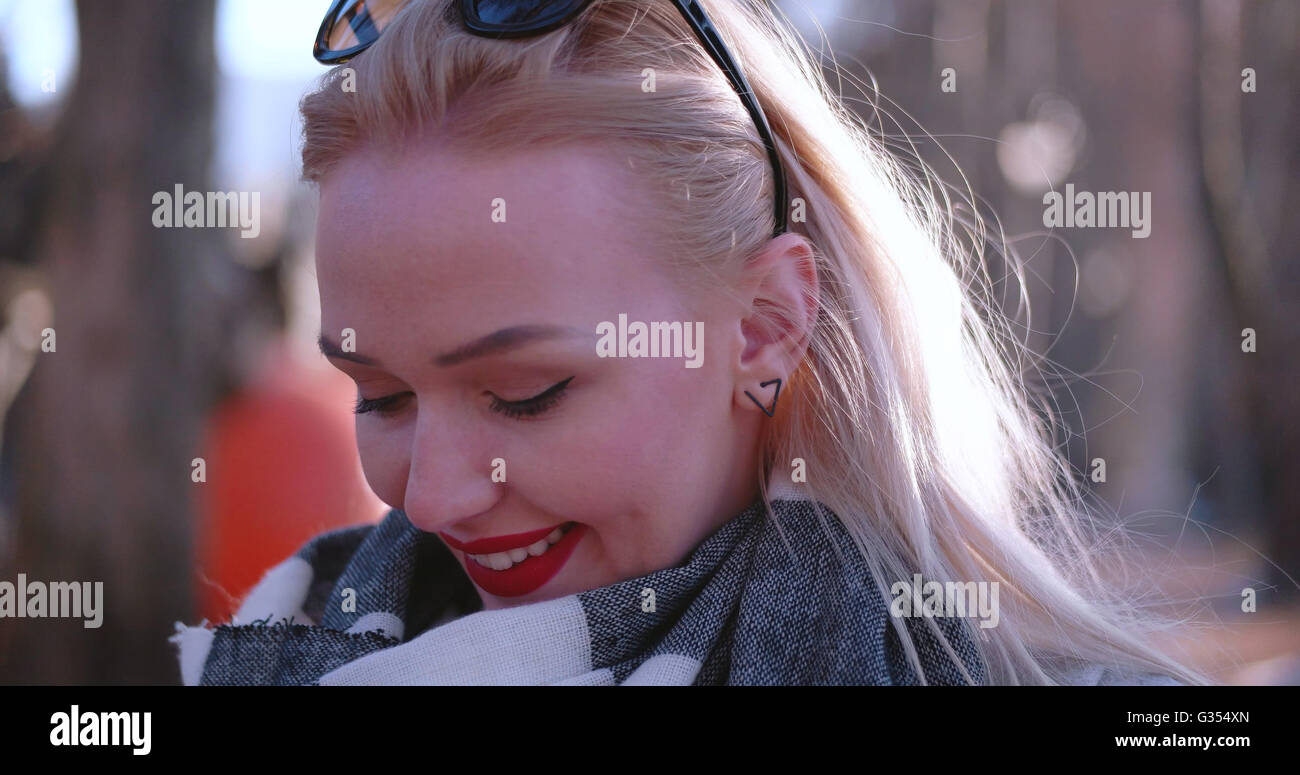 Beautiful blonde woman smiling to the camera Stock Photo - Alamy