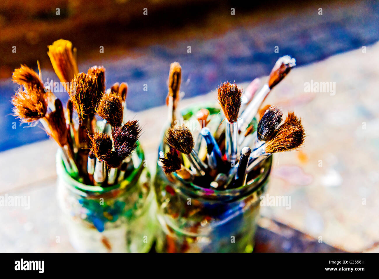 Many different brushes ; viele verschiedene Pinsel mit Farbe Stock Photo
