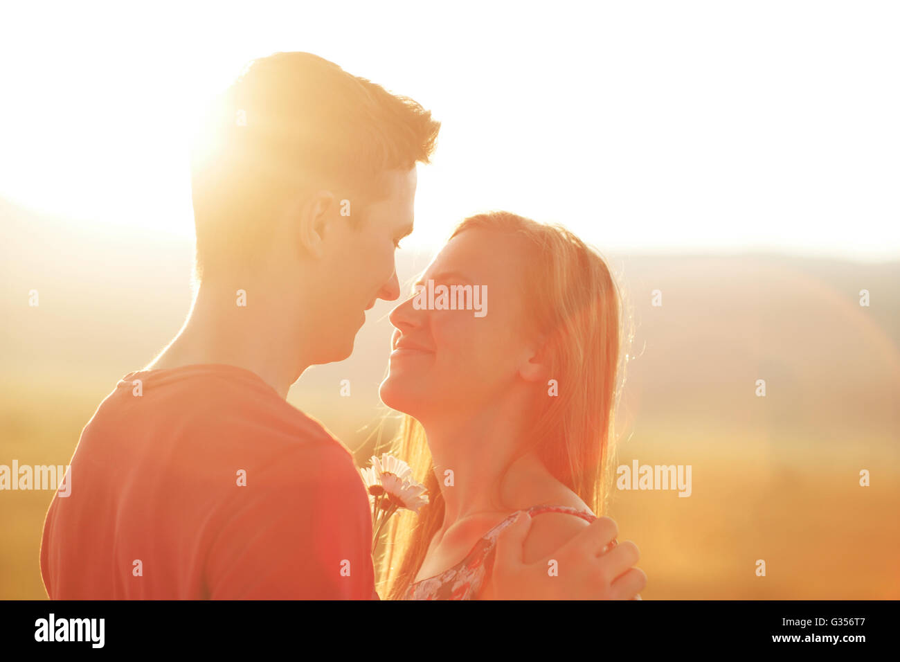 silhouette of a loving couple at sunset Stock Photo - Alamy