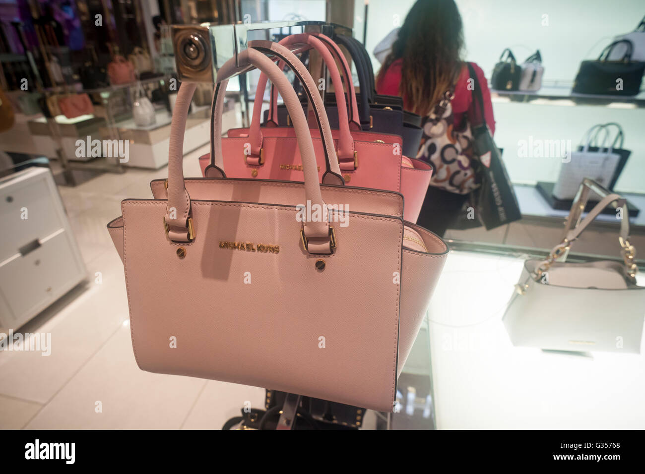 Handbags on display at the Michael Kors boutique within Macy's in New York  on Tuesday, August 4, 2015. First-quarter sales and profits for Michael  Kors handbag designer beat analysts' expectations, albeit low