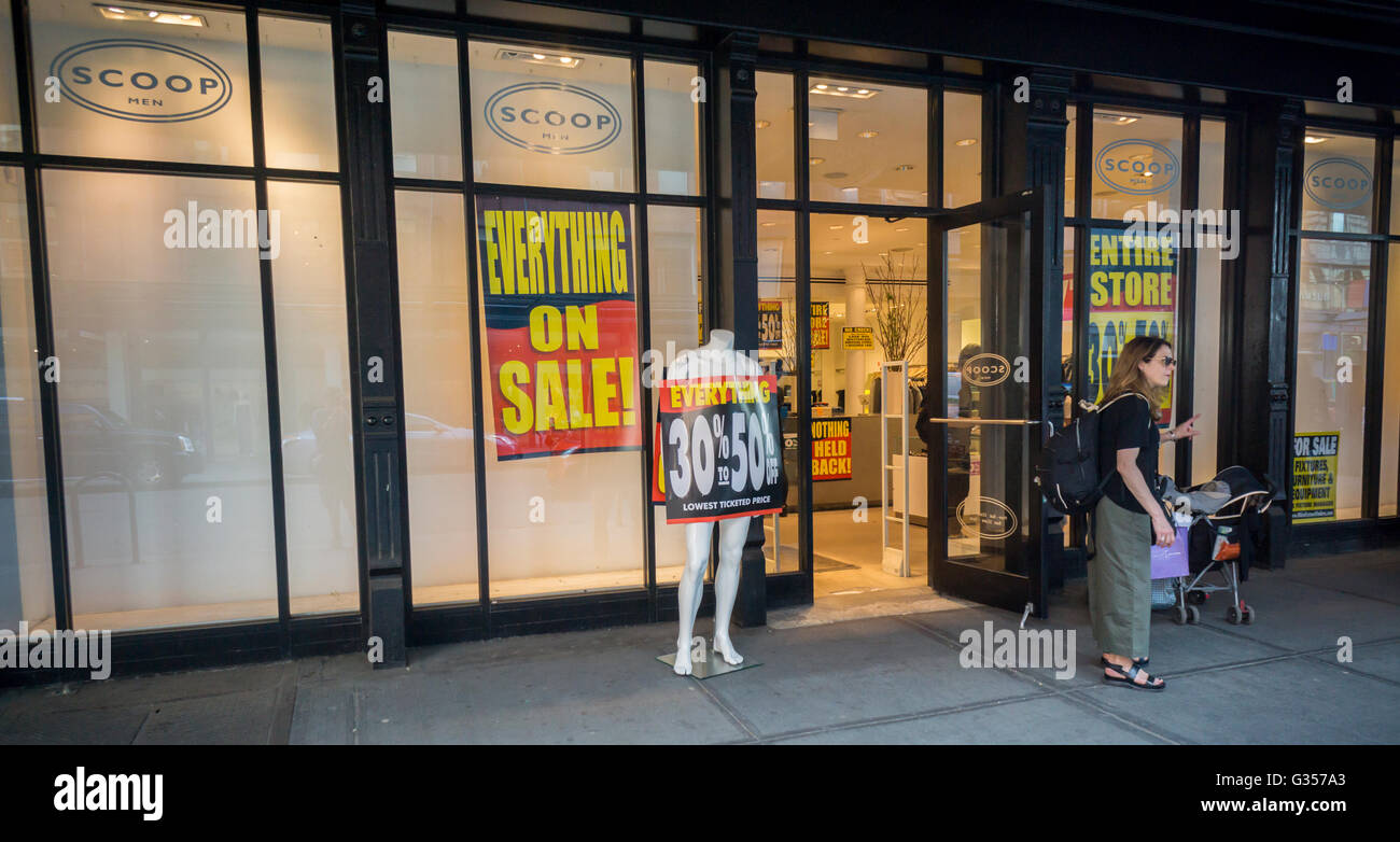 Liquidation signs are featured in the Scoop NYC store in the Meatpacking District in New York on Wednesday, June 1, 2016. The 20 year old clothing chain is shutting down and closing all of its stores citing high rents and other retail competition. Scoop NYC is currently owned by private equity firm Yucaipa Cos.  (© Richard B. Levine) Stock Photo