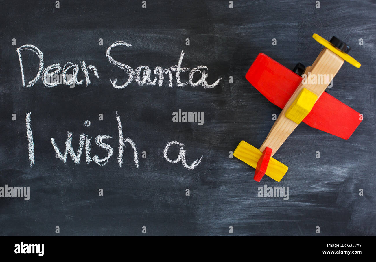 Dear Santa is written on a blackboard and christmas gift Stock Photo