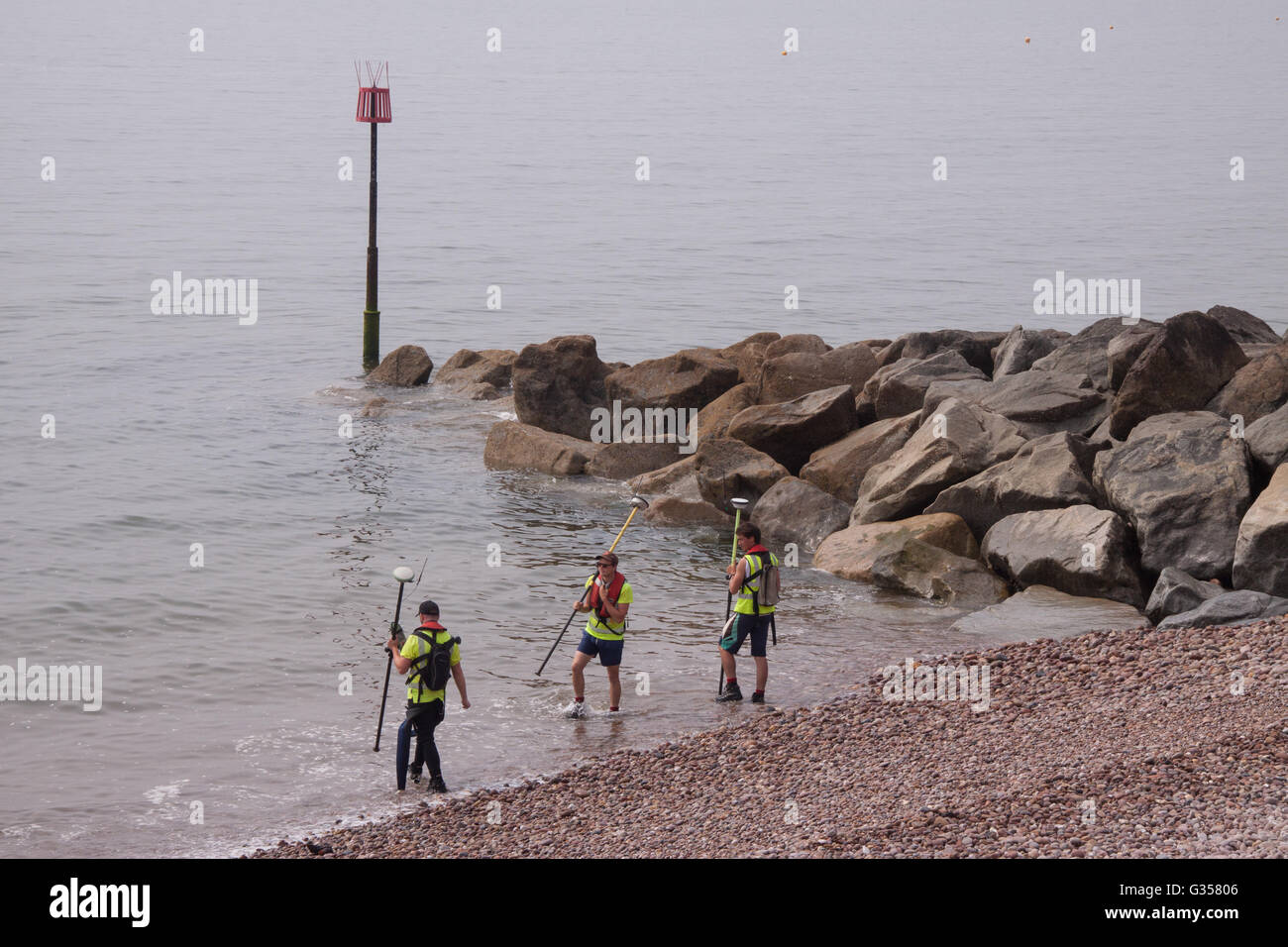 Shoreline and beach at Sidmouth, Devon, undergoing a GPS based survey by staff of EDI Surveys. Stock Photo