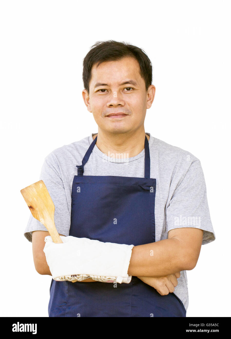 Asian Man With Frying Tool And Cooking Glove Stock Photo