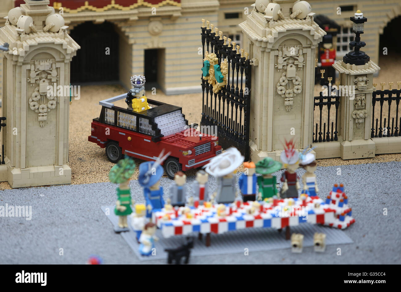 LEGOLAND Windsor Resort in Windsor unveils a miniature street party outside a model of Buckingham Palace in Miniland ahead of the Patron's Lunch on The Mall in London to mark the Queen's official 90th birthday on June 12. Stock Photo