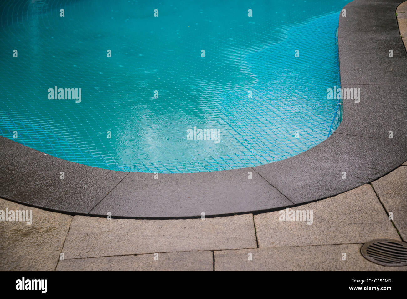 Pool in rain Stock Photo Alamy