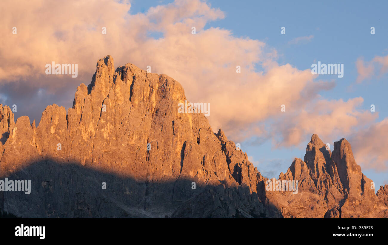 Italian dolomites. Mountain landscape from "San Martino di Castrozza" during "Enrosadira" phenomenon. Geological formations Stock Photo